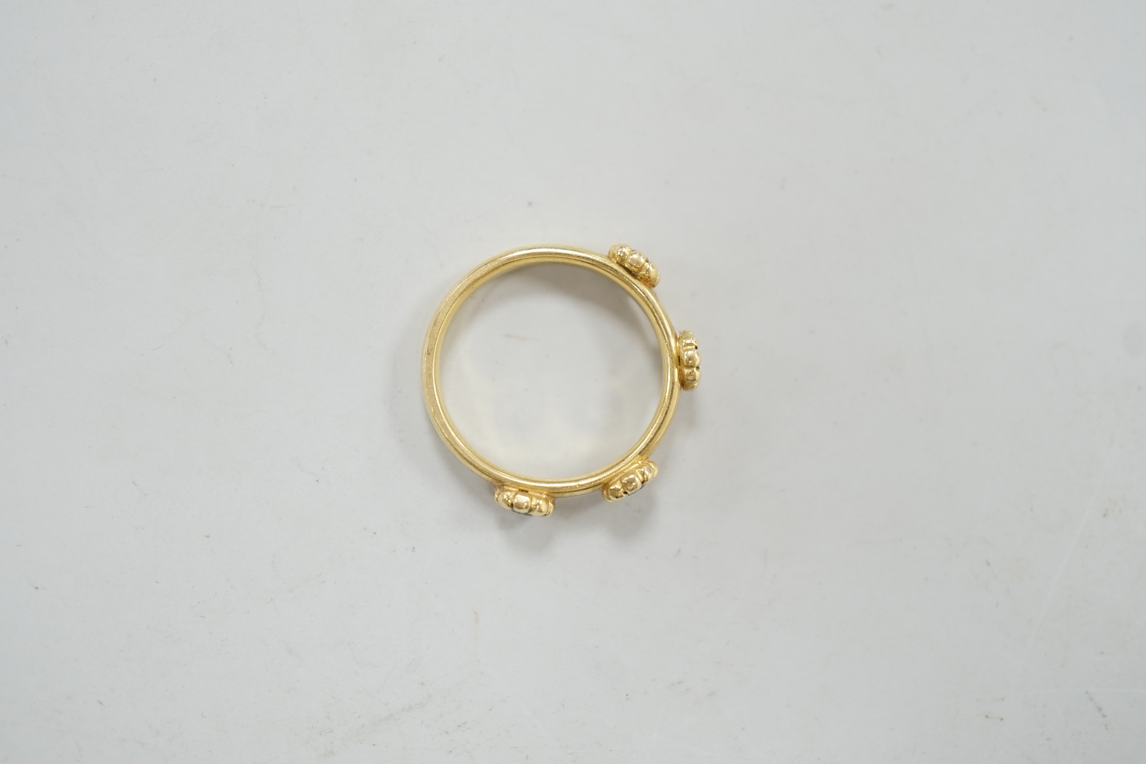 A modern 18ct gold and four stone diamond set ring, size K, gross weight 4 grams.